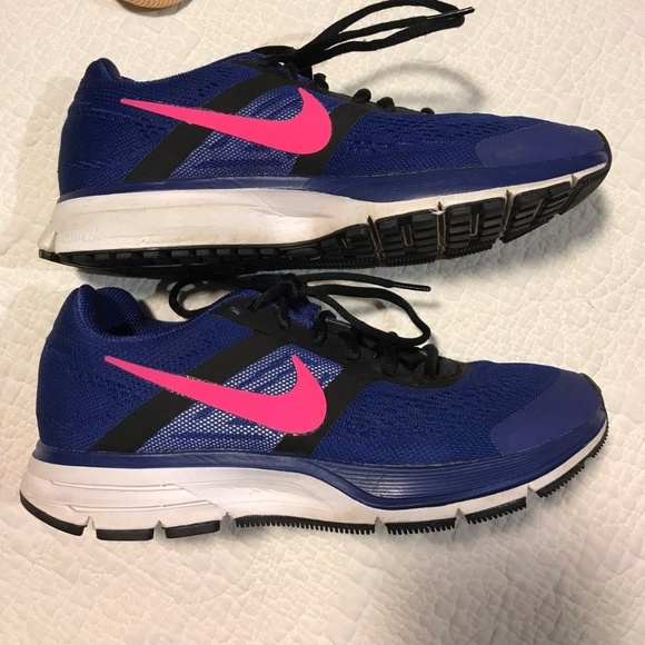 black nike shoes with blue swoosh